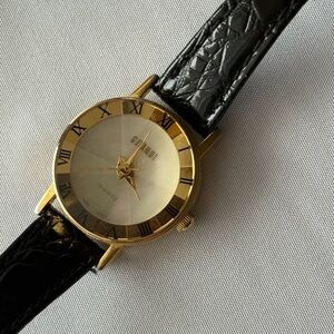 Woman’s Vintage Gold and Black Watch